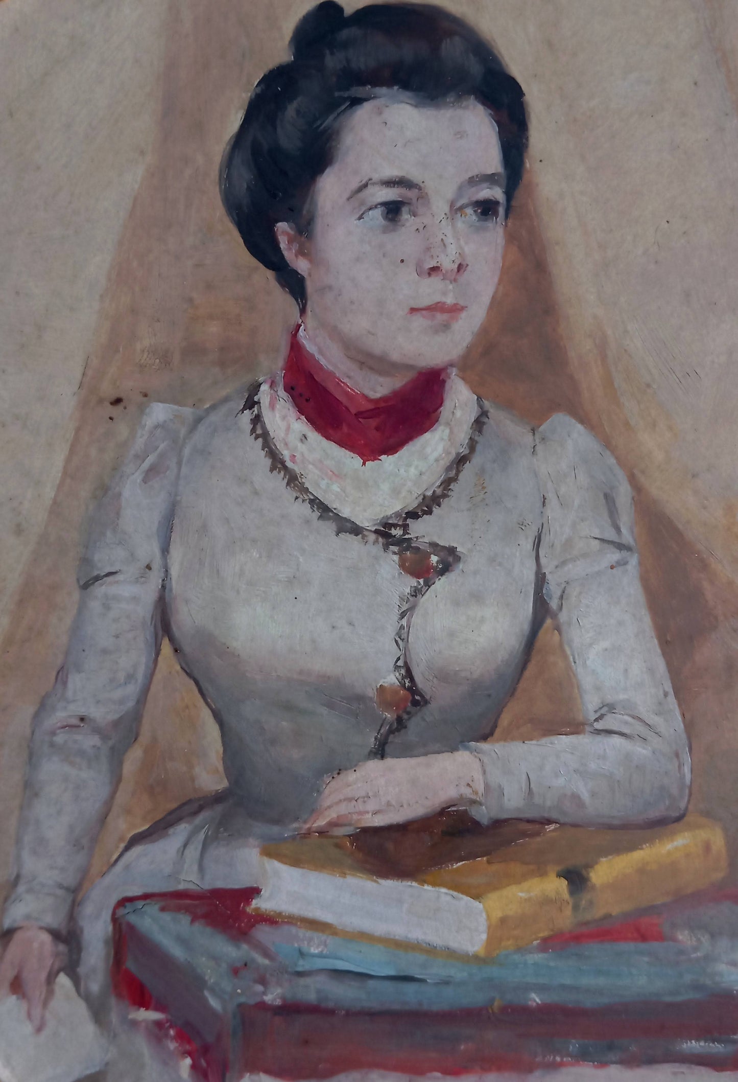 Portrait of an elegant woman holding a book
