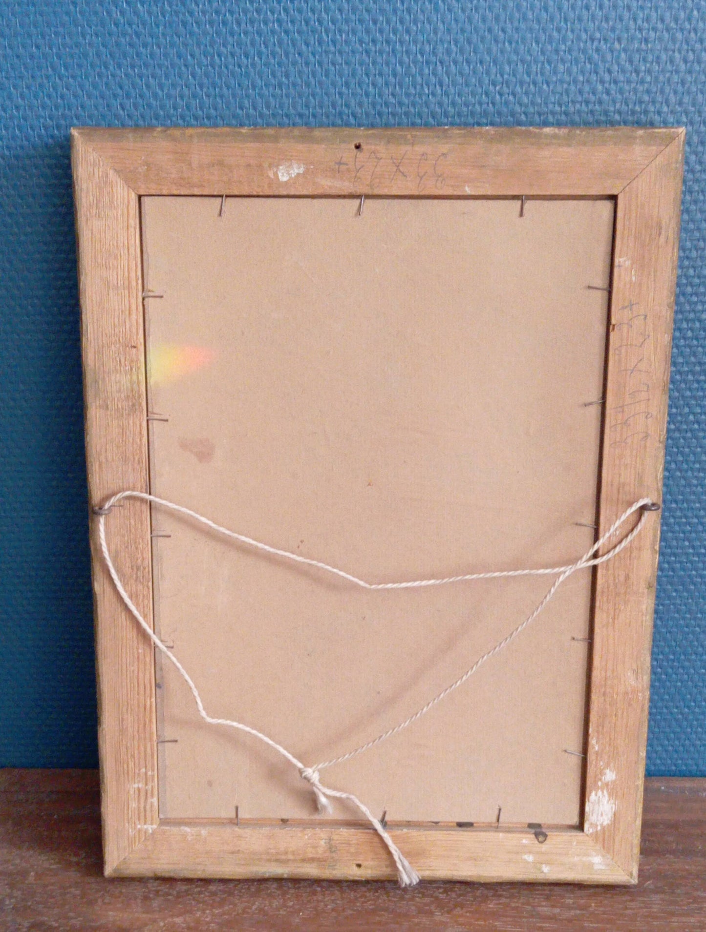 Still life. Flowers in a blue-gray vase on a tablecloth