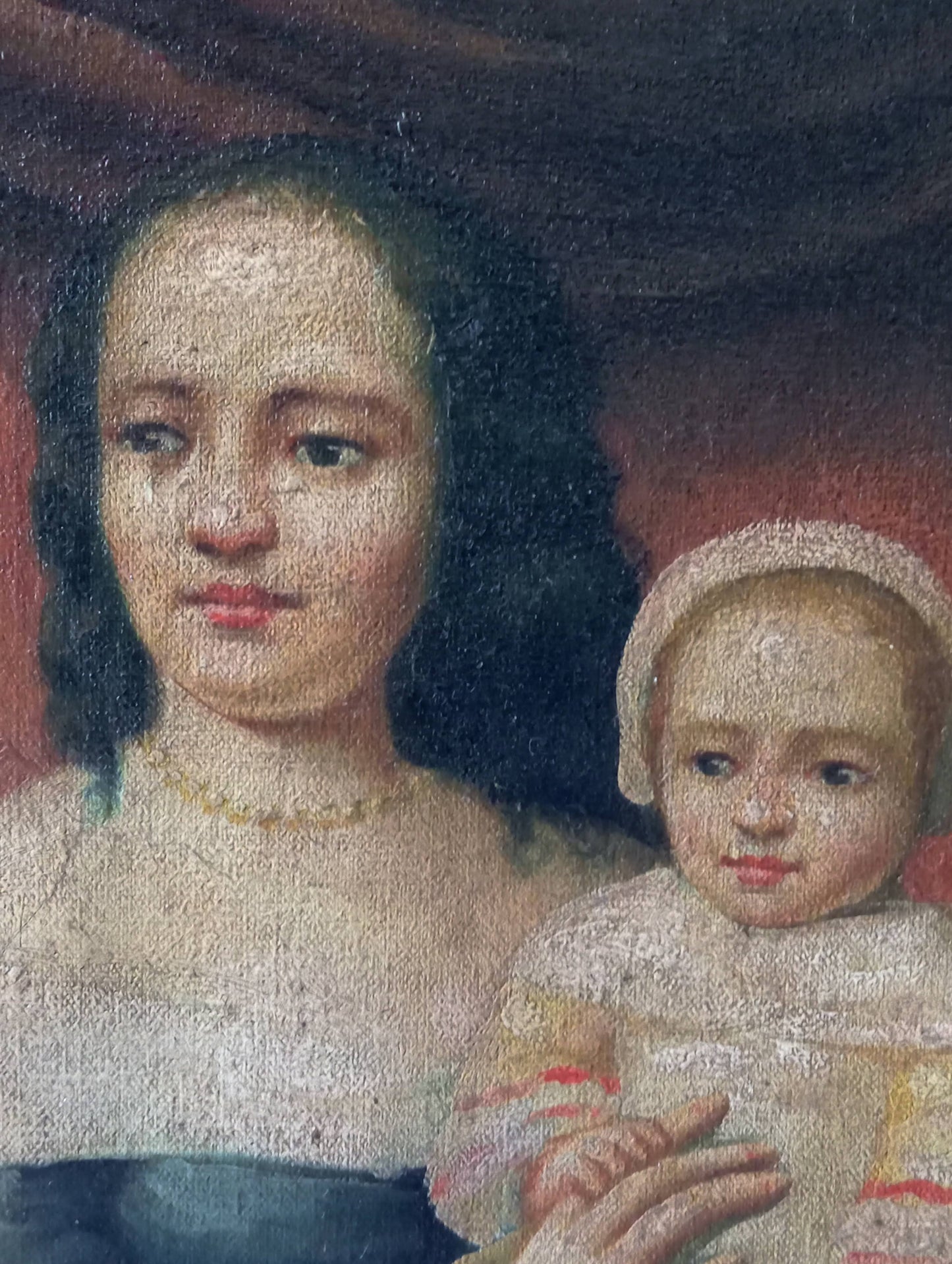 Portrait of a mother carrying her child
