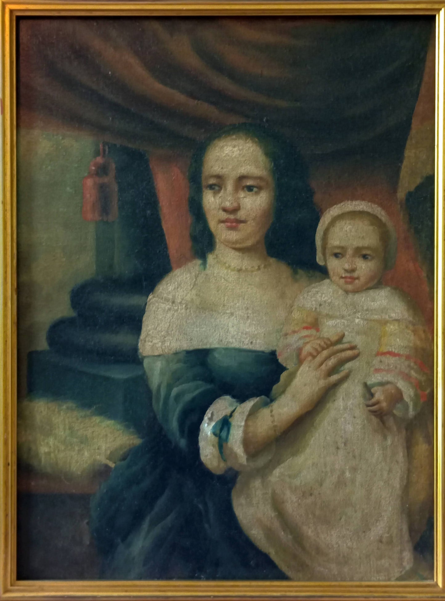 Portrait of a mother carrying her child