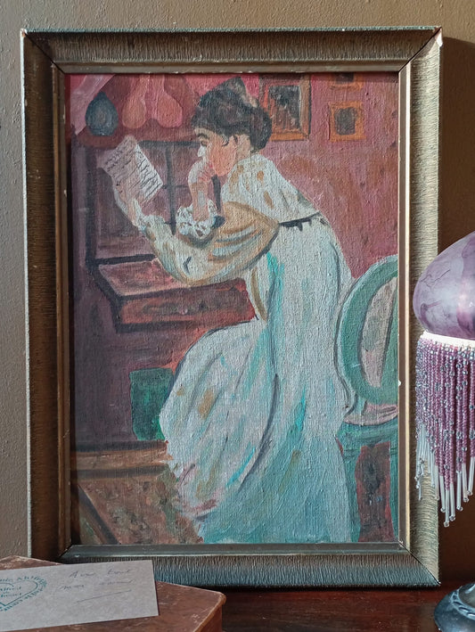 Portrait of a young woman with a bun reading