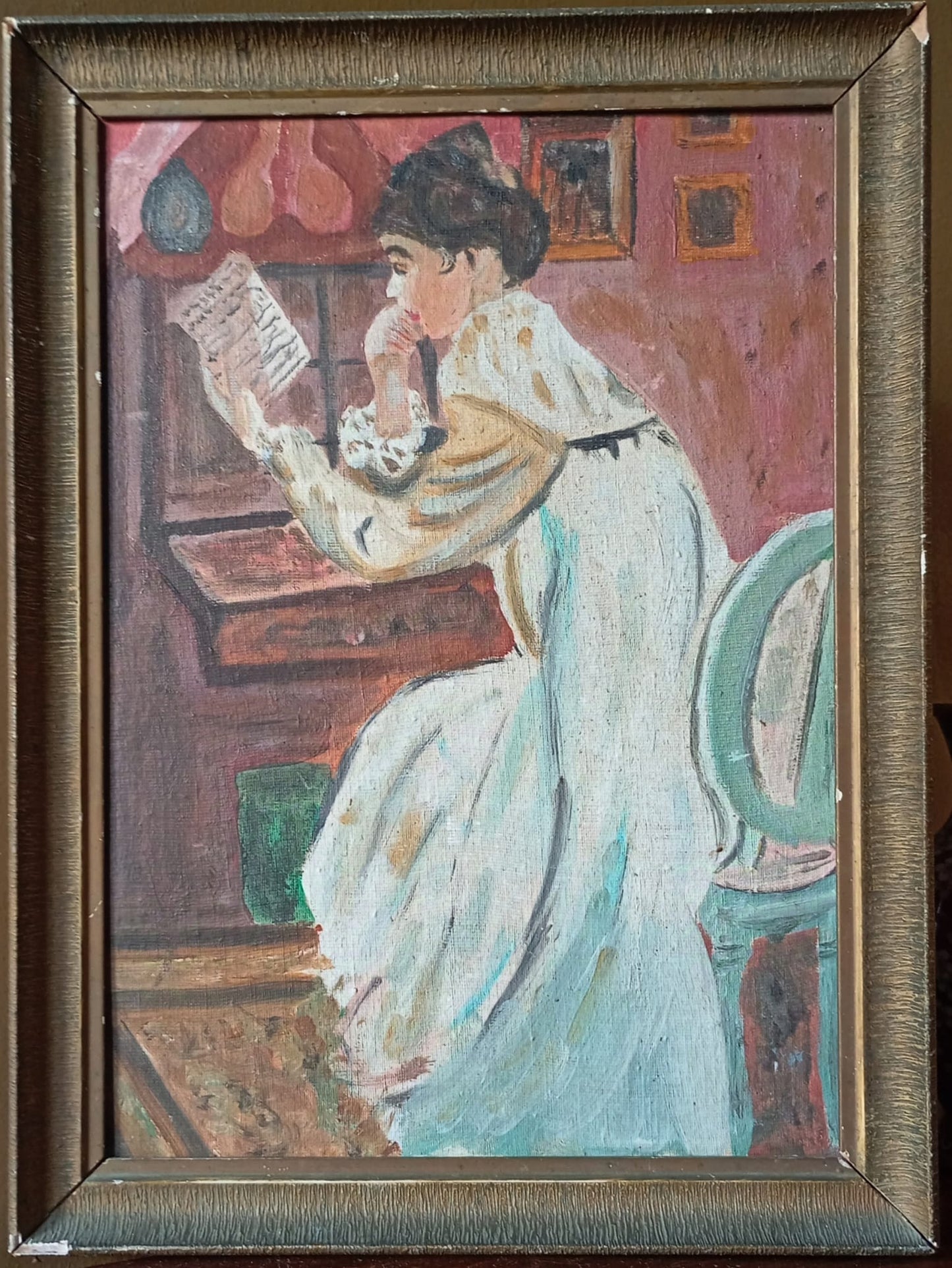 Portrait of a young woman with a bun reading