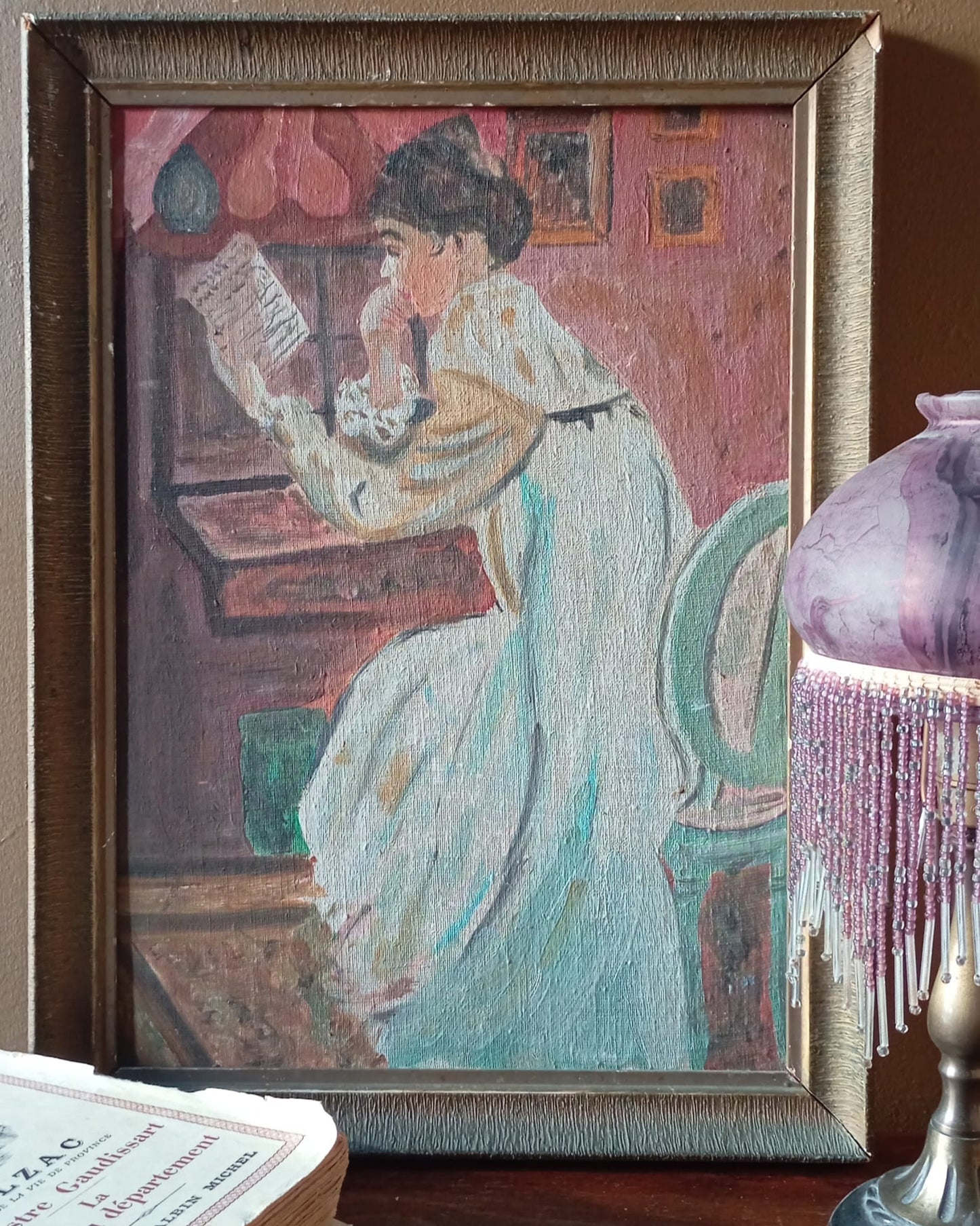 Portrait of a young woman with a bun reading