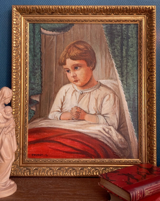 Portrait of a child in prayer