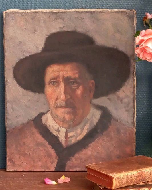 Portrait of an old man with a hat