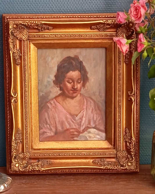 Portrait of a woman sewing