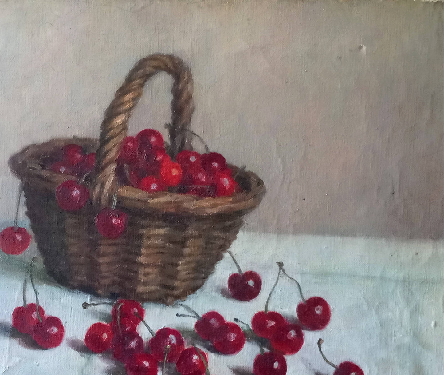 Nature morte. Cerises dans un panier