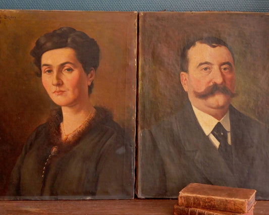 Two old portraits of a bourgeois couple