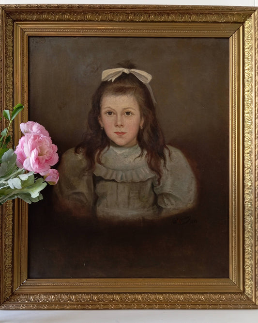 Portrait of a young girl with a ribbon