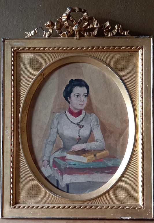 Portrait of an elegant woman holding a book