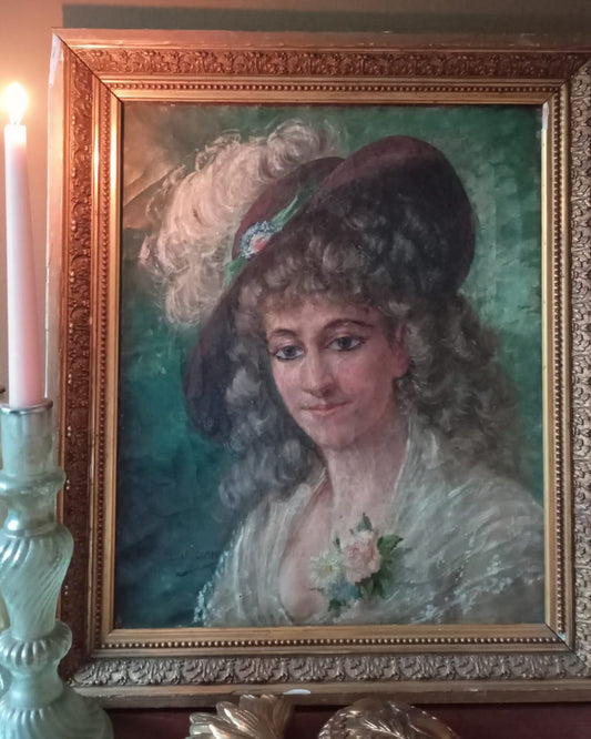 Old portrait of a woman wearing a hat